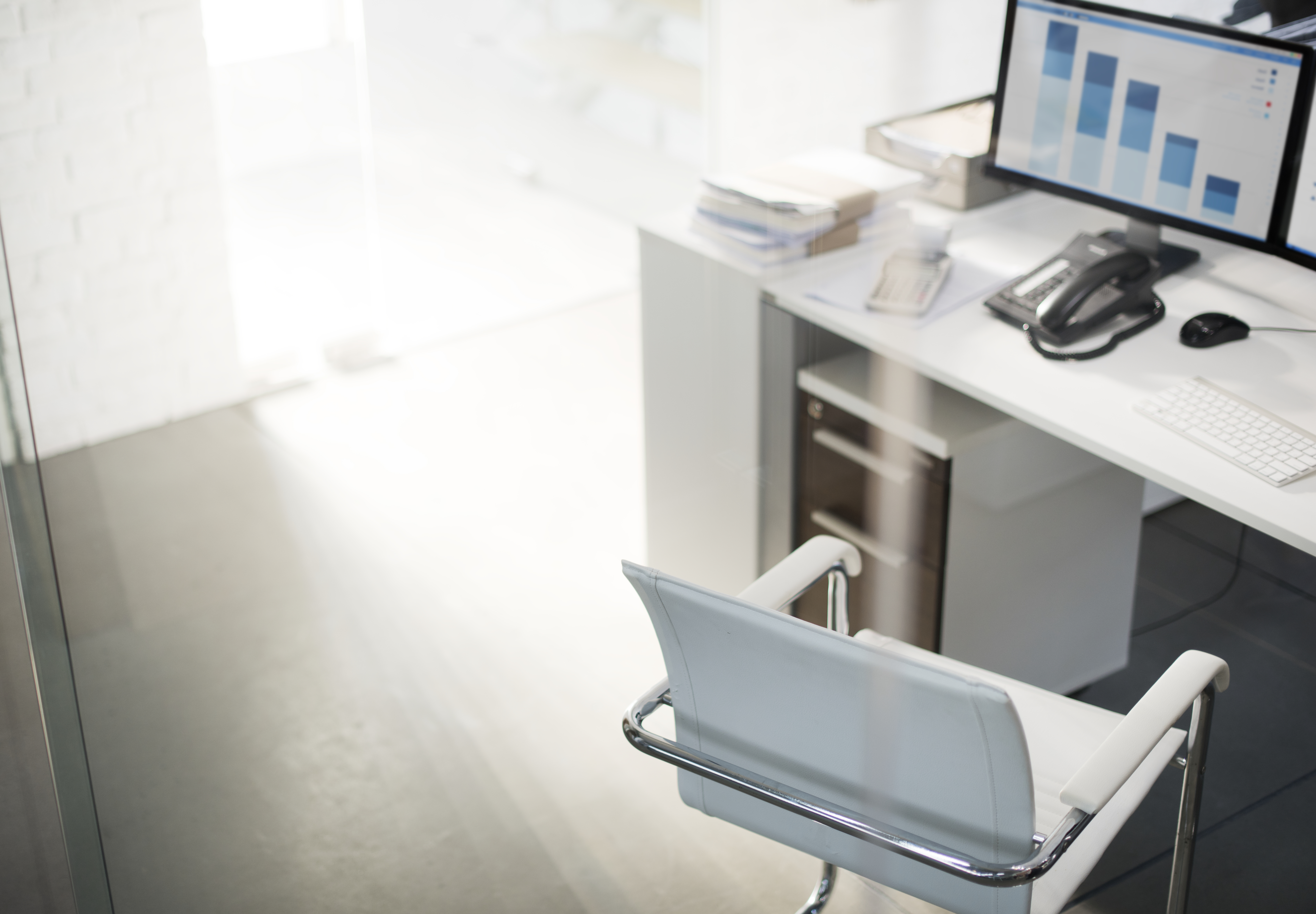 office-workspace-with-computer-desktop-showing-analysis-graph.jpg